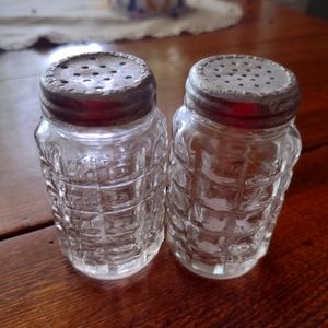 Vintage glass salt and pepper shakers.